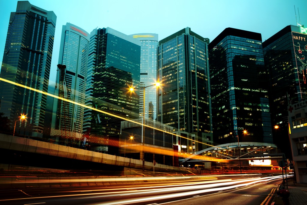 moving car with blur light through city at night